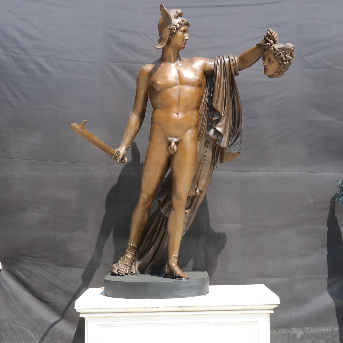 Greek Male Nude Statues showing Perseus holding the severed head of Medusa