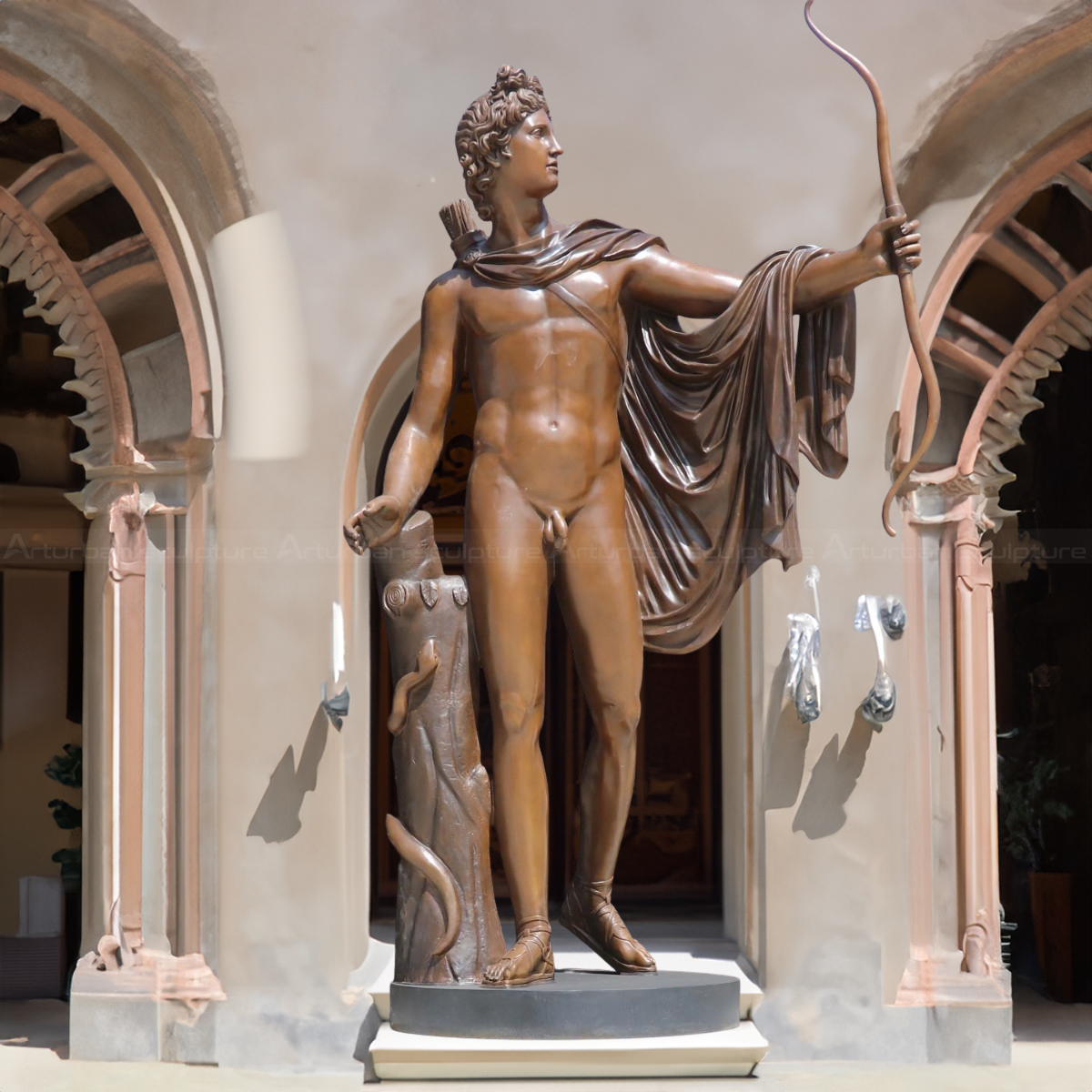 Greek Male Nude Statues standing beside a tree stump holding a bow and wearing a flowing cloak