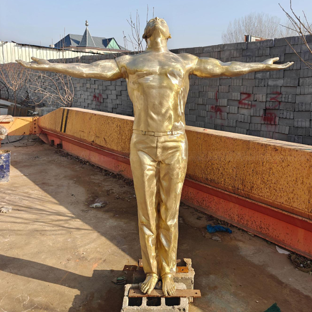 Man with Arms Out Unpainted bronze Statue