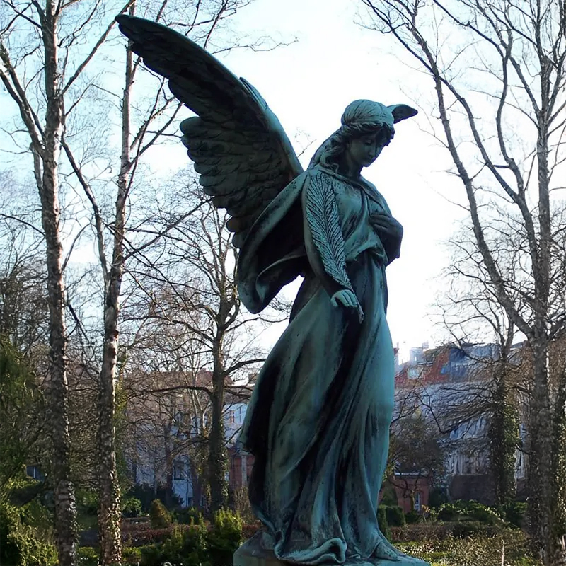 Mourning Angel Statue standing and holding a palm leaf