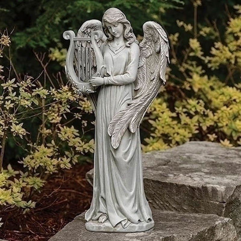 Music from Heaven Angel stone Statue showing an angel holding a lyre