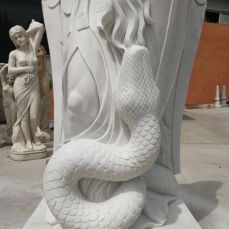 Outdoor Statue of St Michael showing detailed scale texture of snake