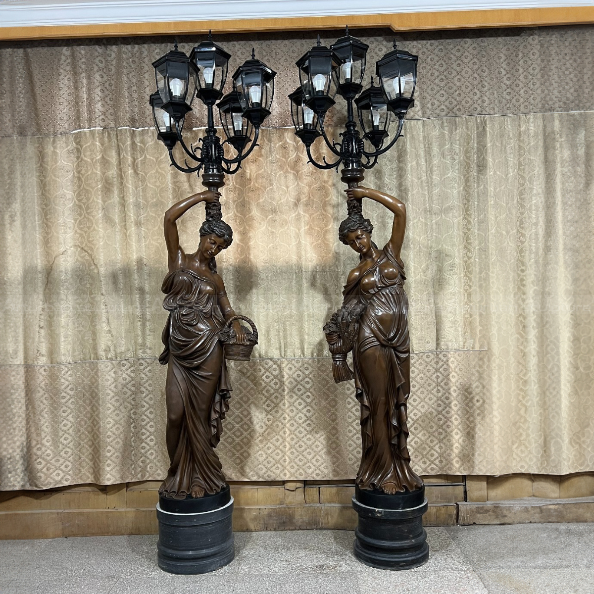Pair of bronze European Decorative classical female figure holding multi-head Lamp Statue