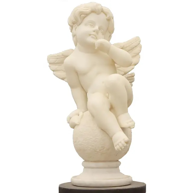 Resin Cherub Statue sitting on a textured globe