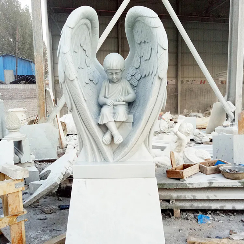 Sitting Cherub marble Statue holding a book surrounded by large wings