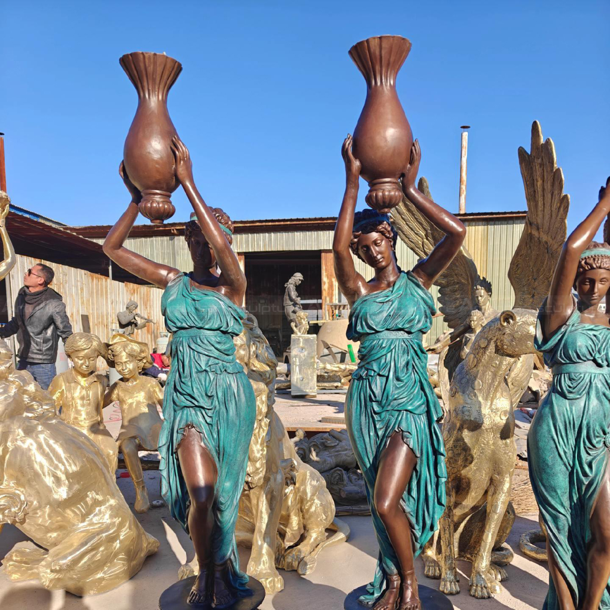 Woman holding Vase Statue raised above head