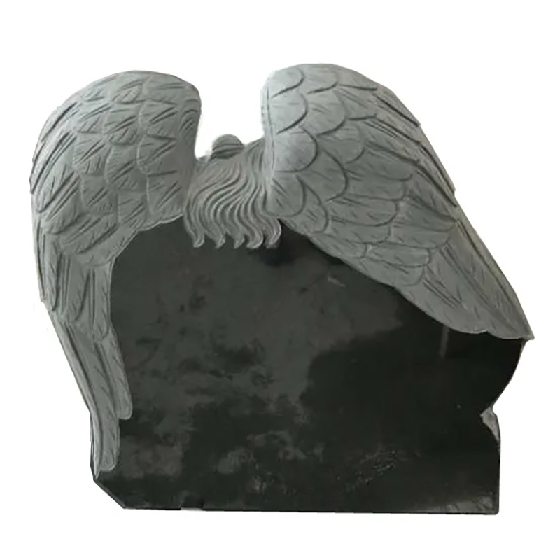 back view of angel lying heart -shaped gravestone sculpture
