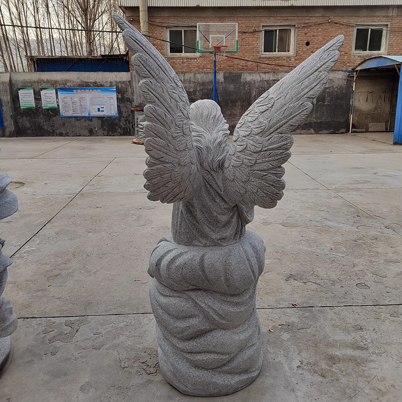 back view of granite Angel Sculpture on a base