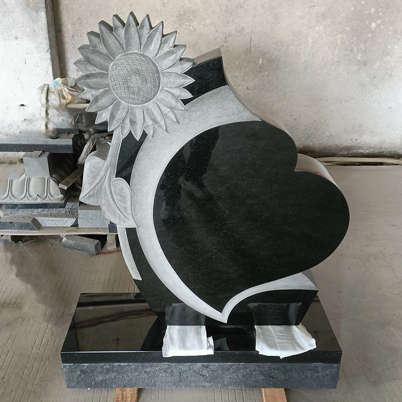 black granite heart-shape Headstone with a carved sunflower