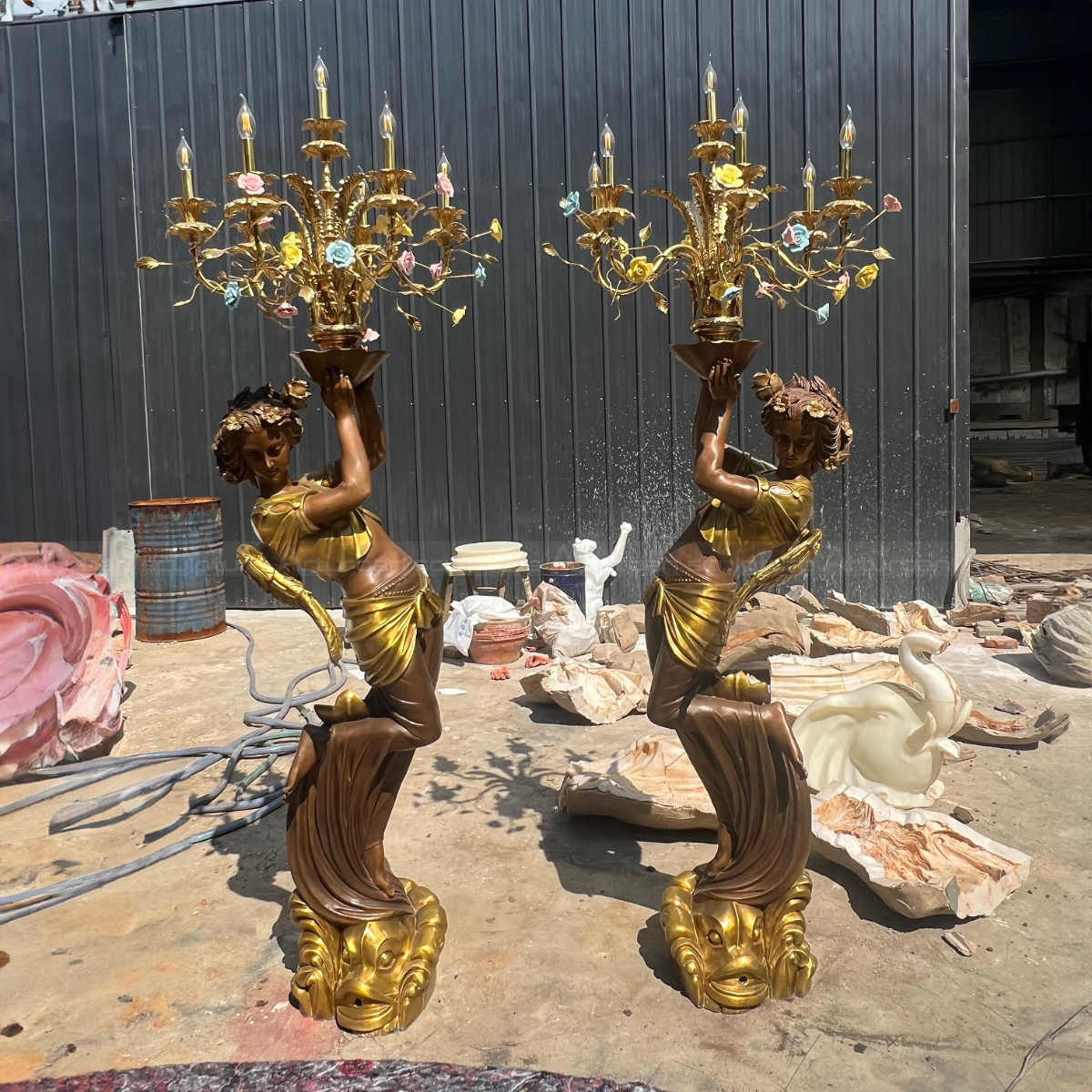 bronze Rococo-style female Statue Holding Lamp with ornate golden candelabra and flowers