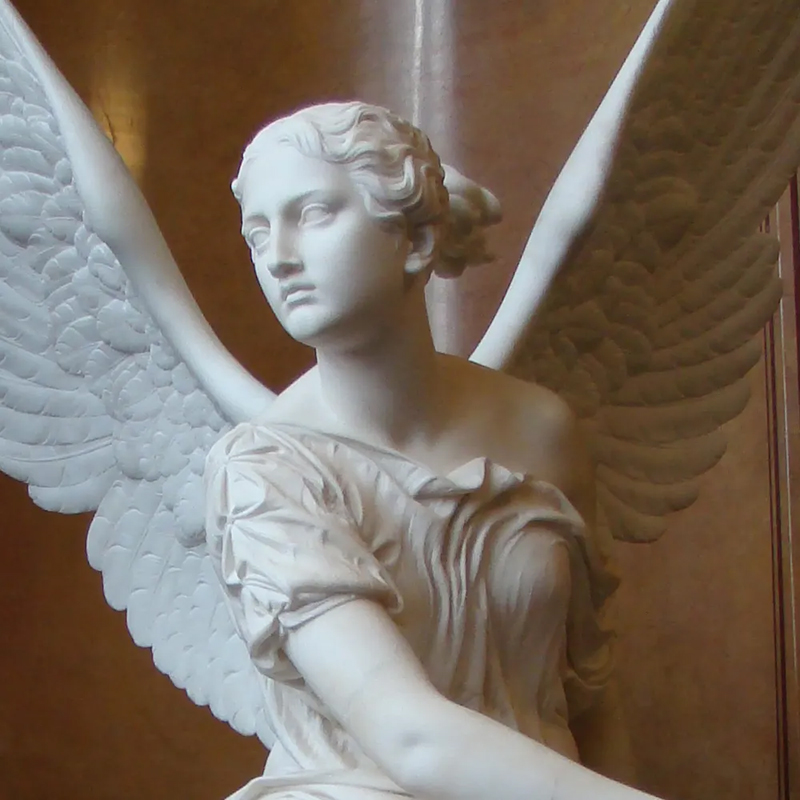 close-up of Nike Angel white marble Statue