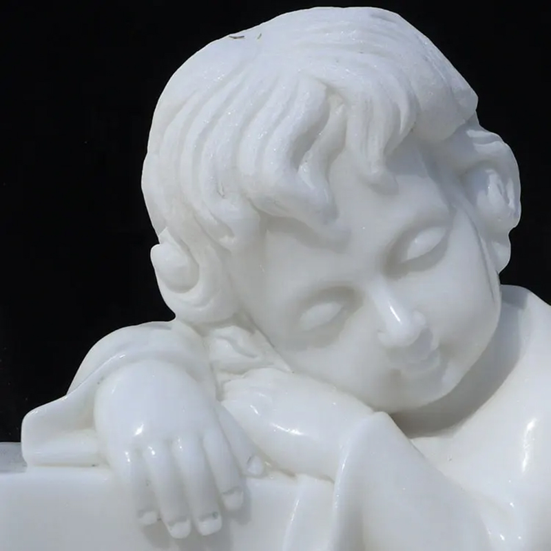 close-up of Sleeping Cherub's face Statue
