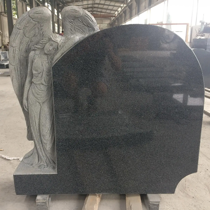 granite Angel standing and leaning on black polished Monument Headstone