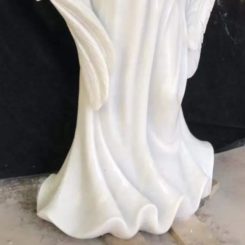 lower part of Angel Holding Flowers Statue showing flowing dress folds