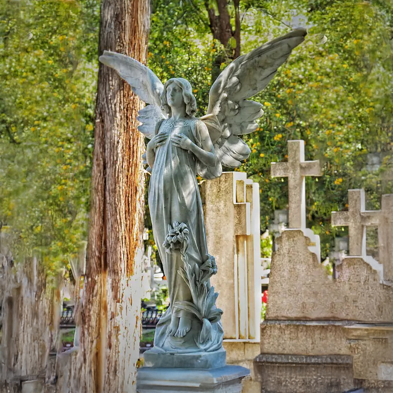 marble Guardian Angel Outdoor Statue with his hands gently touching his chest