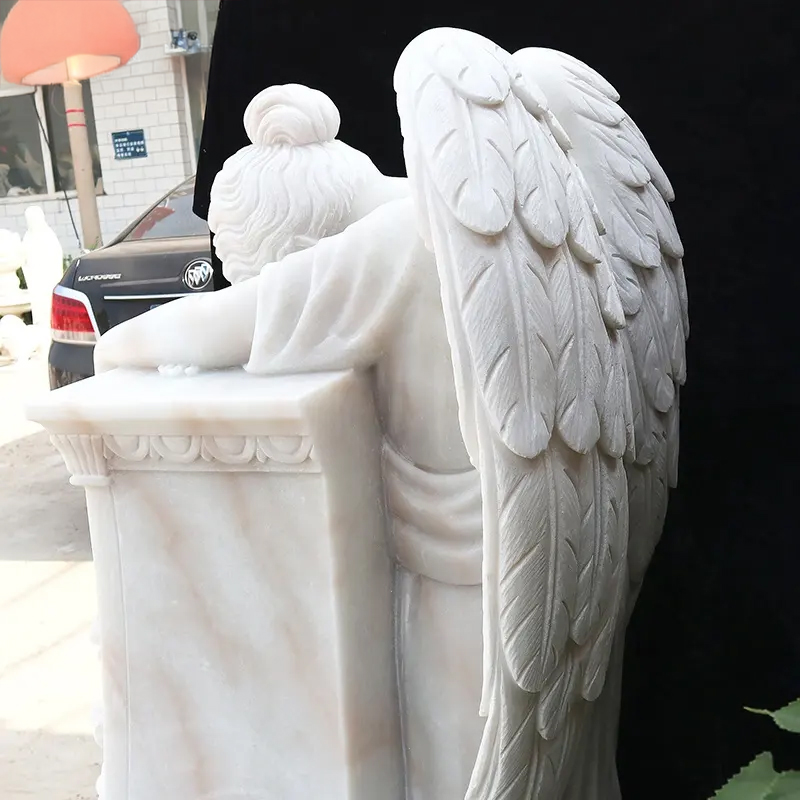 marble angel statue showing delicate details of wings