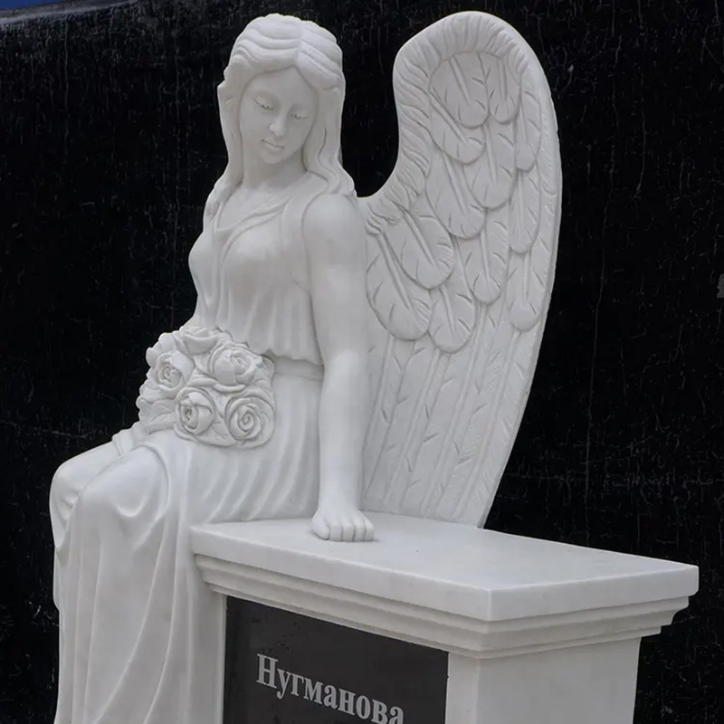 marble sitting Angel Statue Headstone with left hand on the top of tomestone