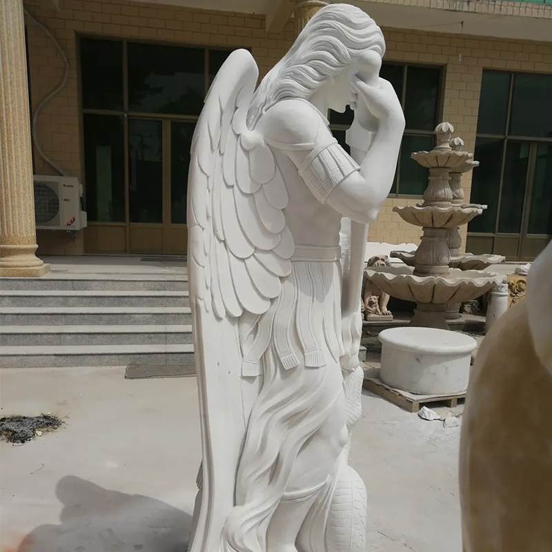 Outdoor Statue of St Michael showing detailed scale texture of snake