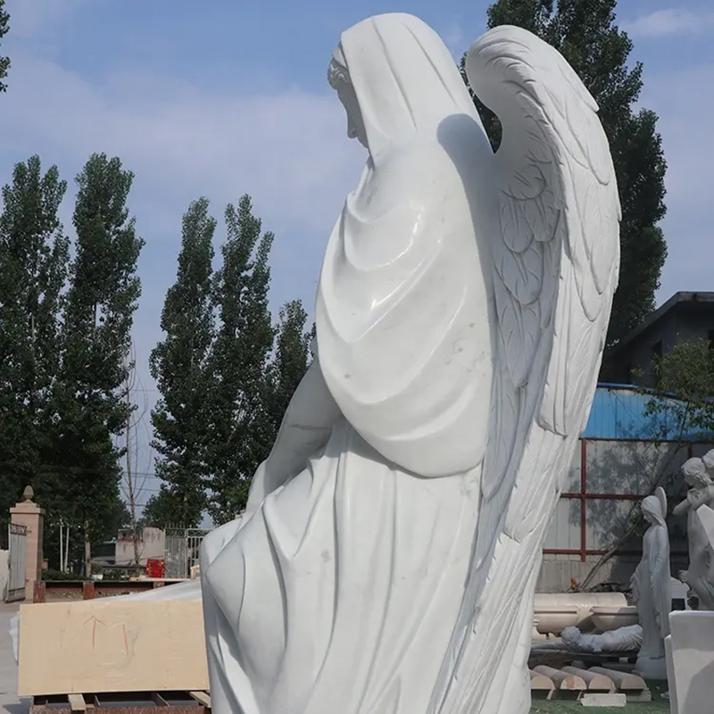 side view of Sitting Garden Angel marble statue