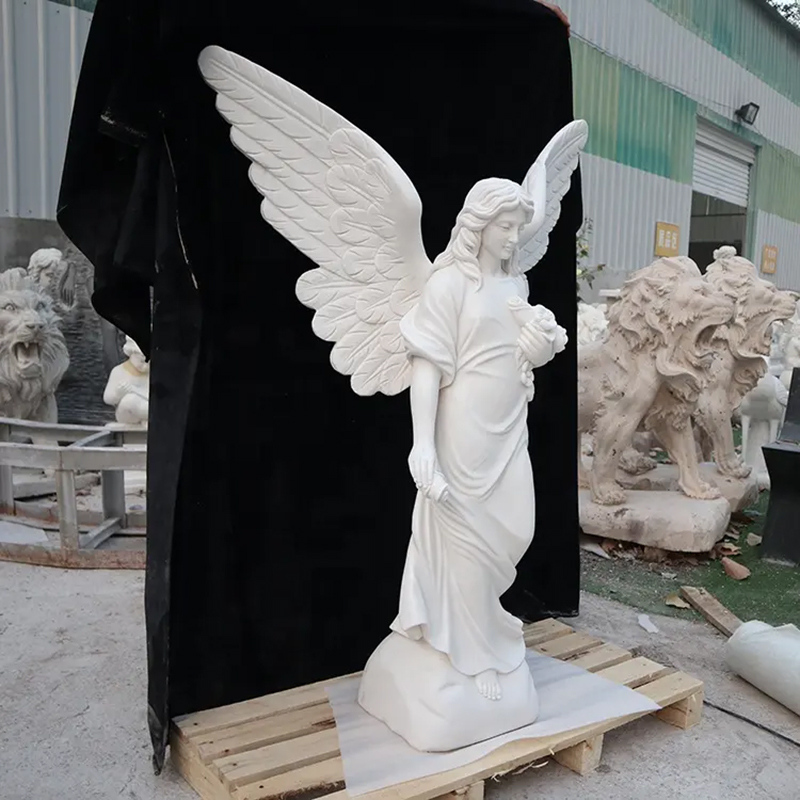 side view of marble Angel with flowers Garden Sculpture for graveside