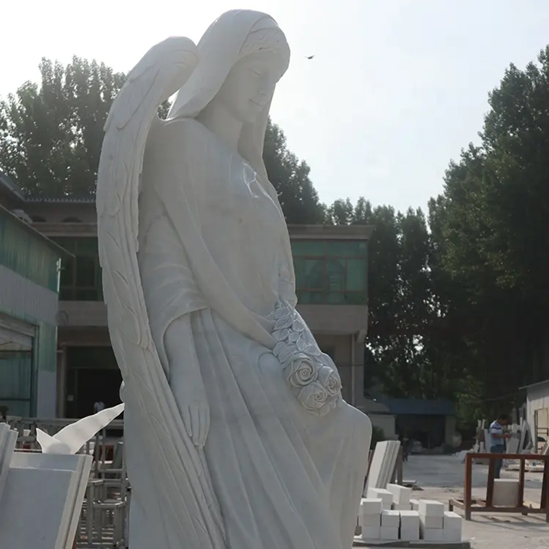 side view of marble Sitting Garden Angel statue