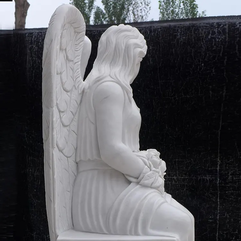 side view of sitting Angel Statue for graveside