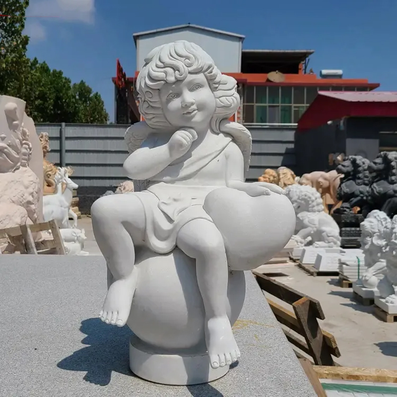 white Stone Cherub on ball Garden Statue