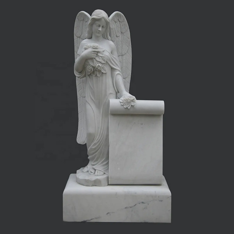 white marble Cemetery Angel standing beside large scroll Headstones holding a bunch of flowers for Sale