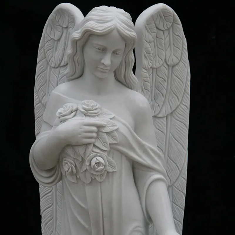 white marble Cemetery Angels holding a bunch of roses