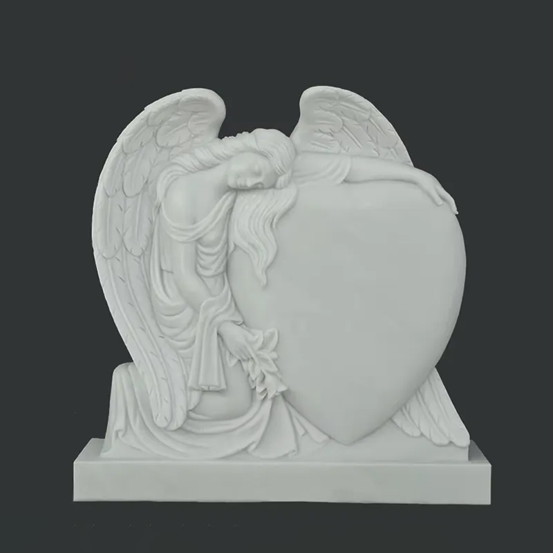 white marble Heart Headstone with Angel leaning on it
