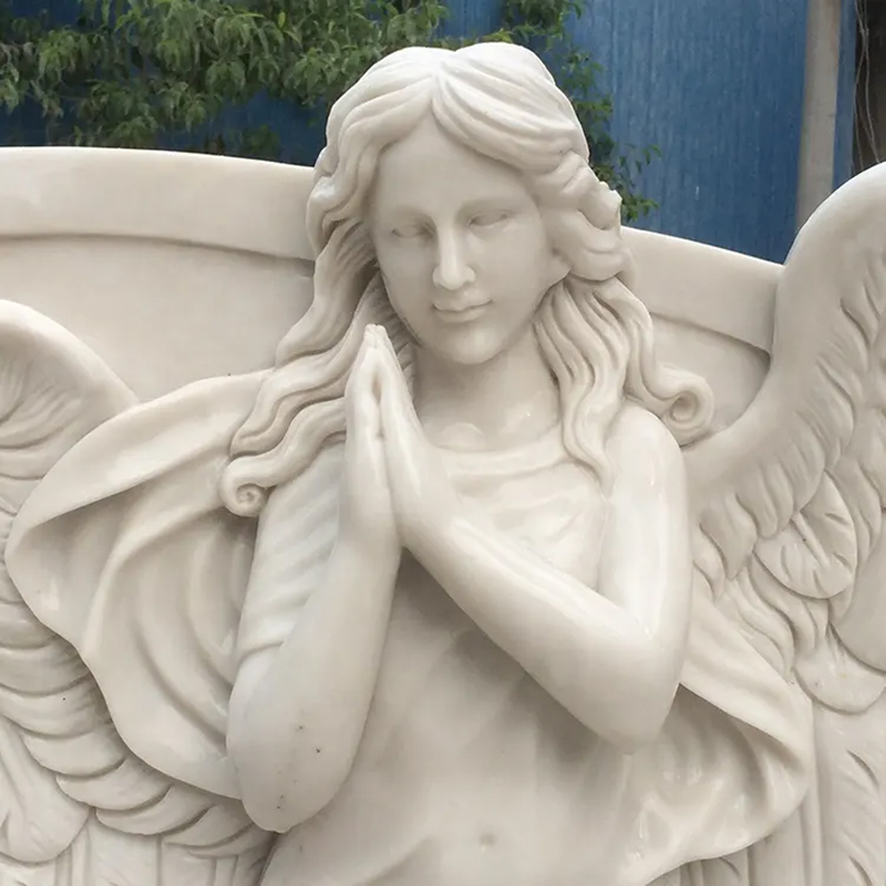 white marble praying Angels on headstone
