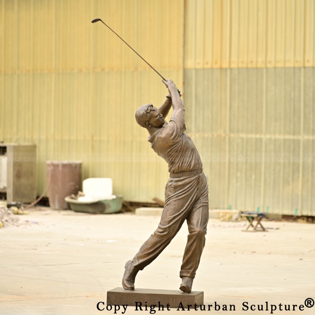 Arnold Palmer bronze statue facing forward with arms raised post-swing