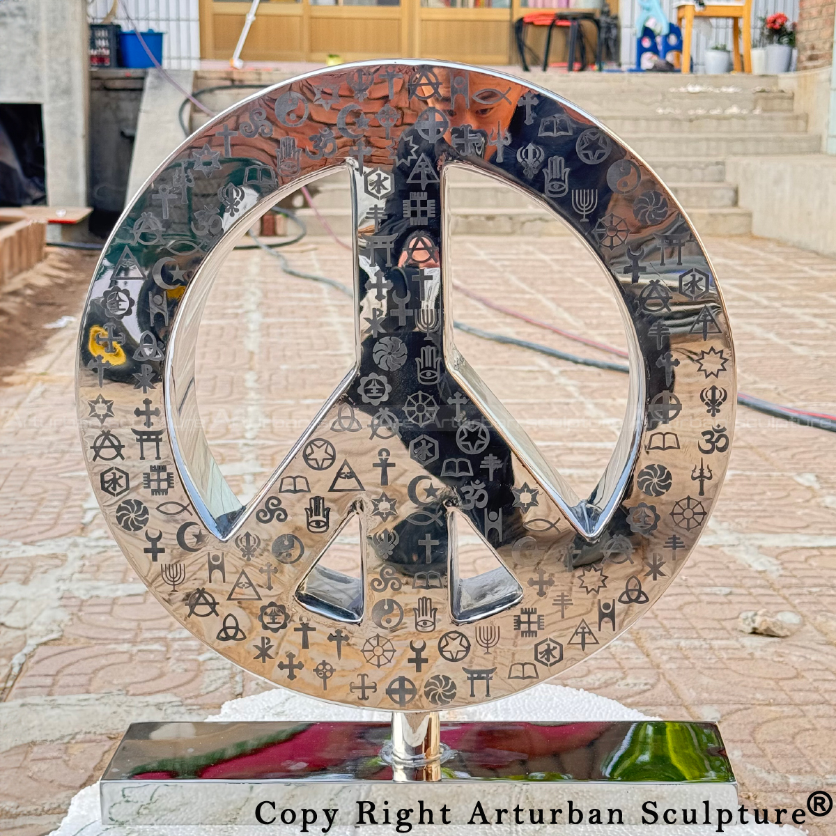 front view of stainless steel Symbol of Peace Statue