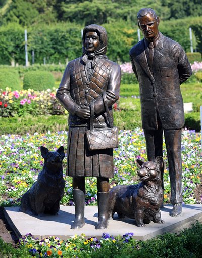 Statue of Queen Elizabeth II, Prince Philip, and Corgis