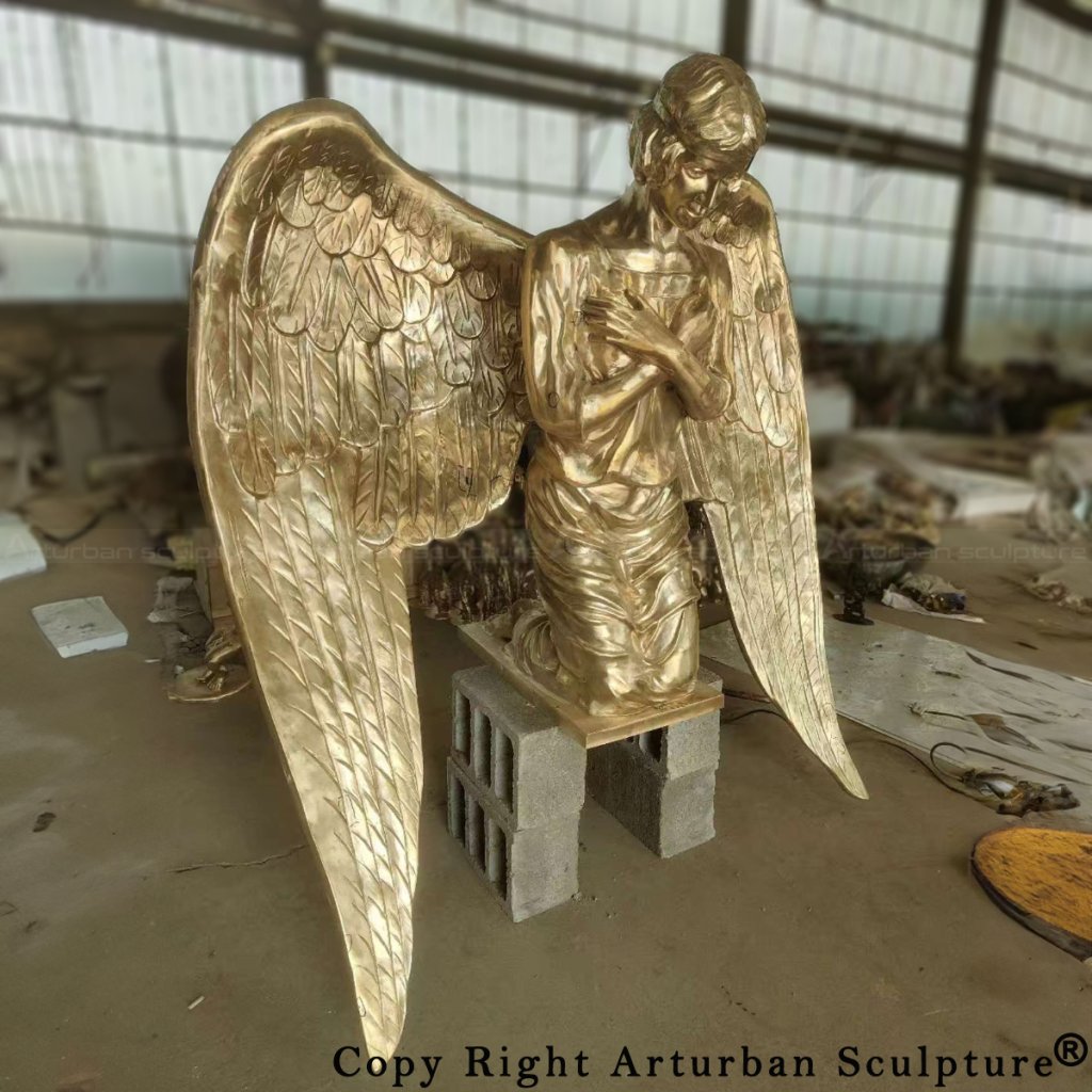 Fully assembled bronze kneeling angel statue after polishing