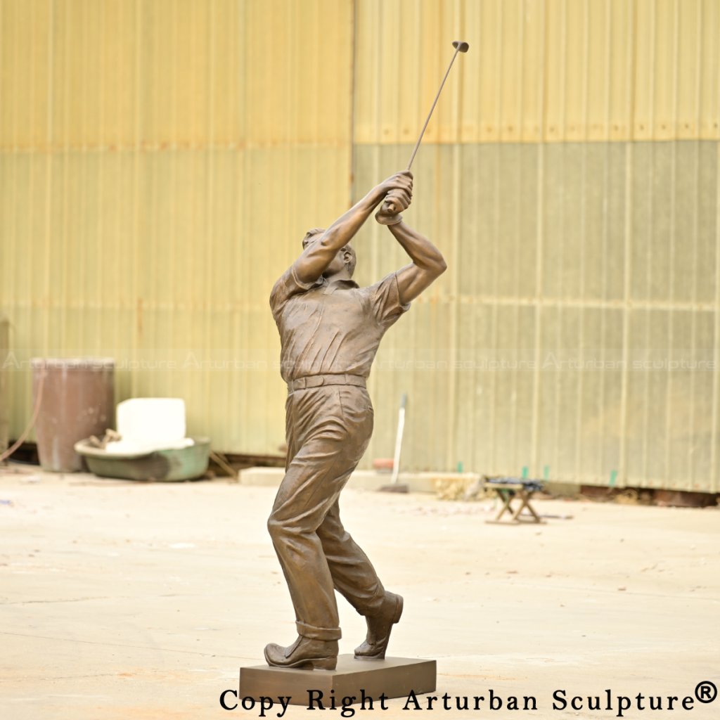 bronze Arnold palmer sculpture completing the classic golf swing