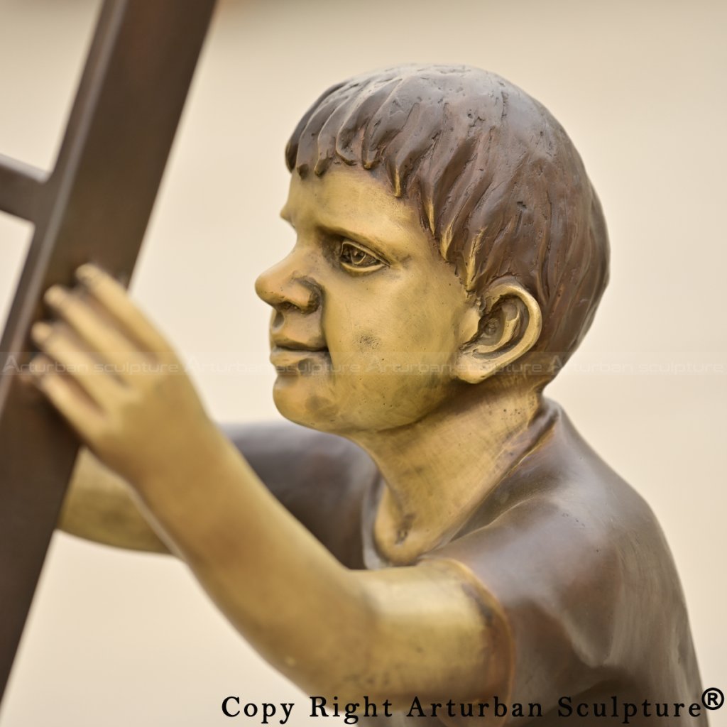 close up of Children on Ladder bronze Sculpture holding the side rail