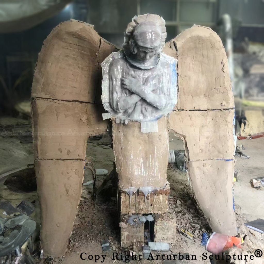 Silicone mold and clay mother mold of a kneeling angel statue