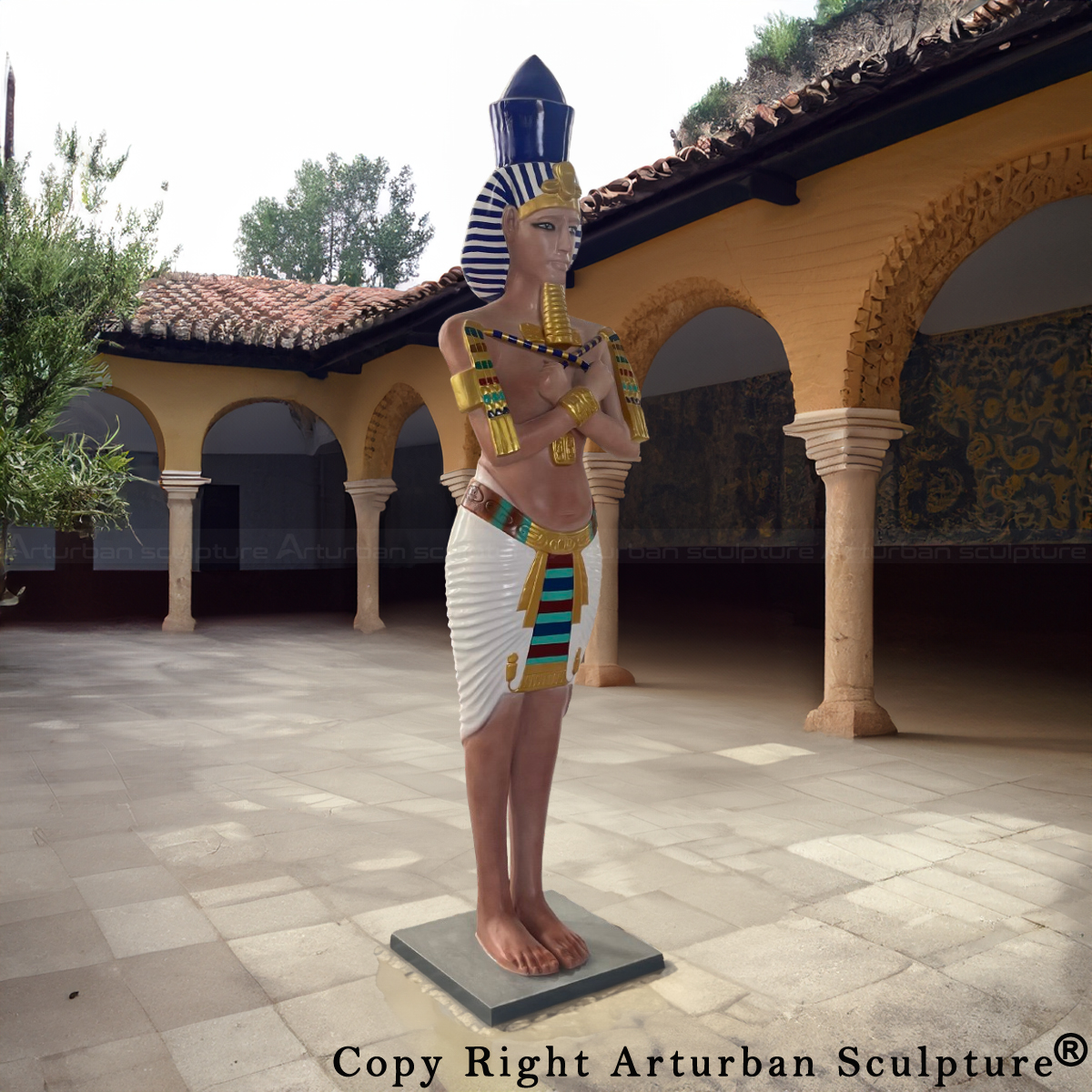 fiberglass Egyptian Pharaoh Sculpture standing in a courtyard