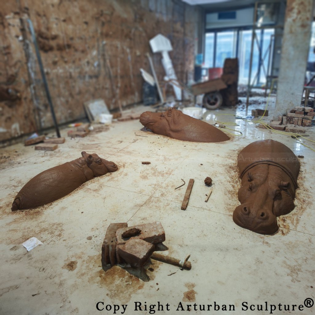 Bronze Hippopotamus sculpture clay models capturing the design of three hippos in different sizes