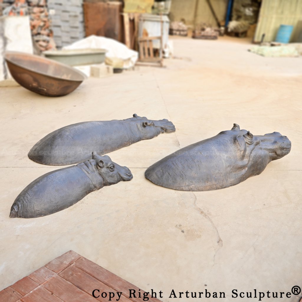 Bronze Hippopotamus sculptures in various positions