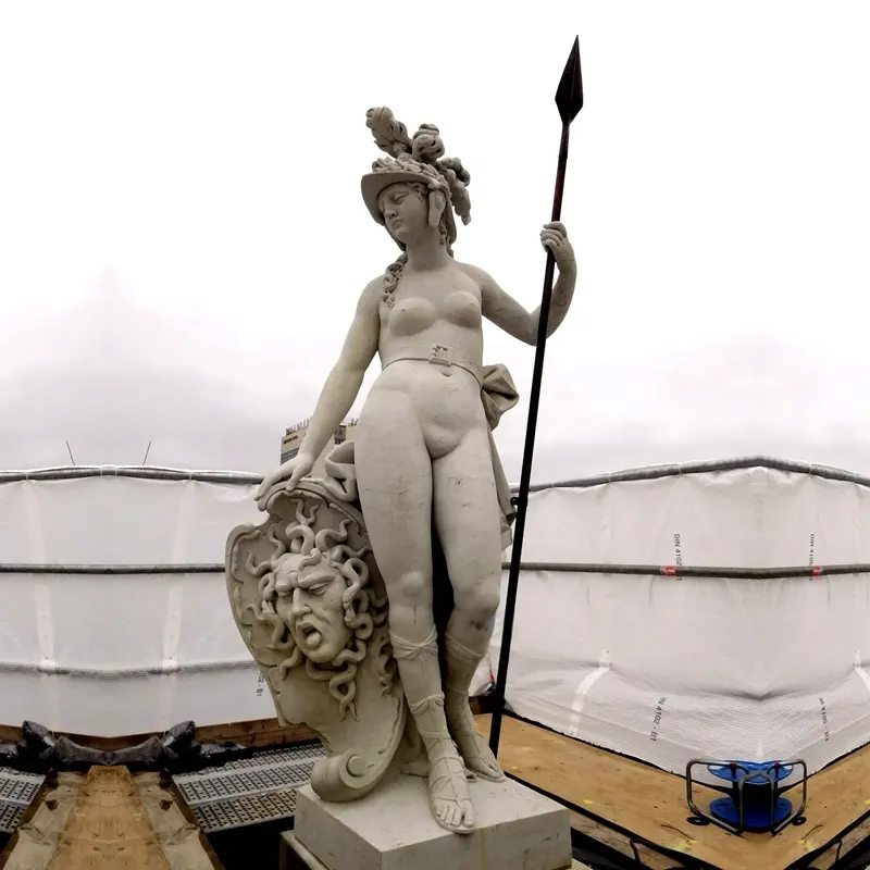 A Minerva Goddess Statue holding a spear and resting on a Medusa shield