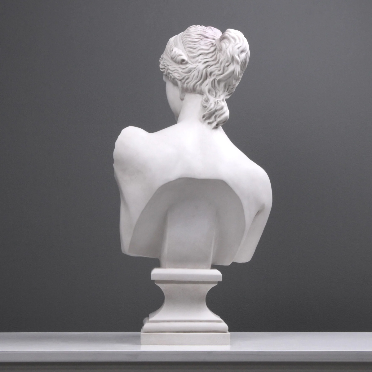 A marble back view of the Contemporary Aphrodite Bust Sculpture with detailed hair texture