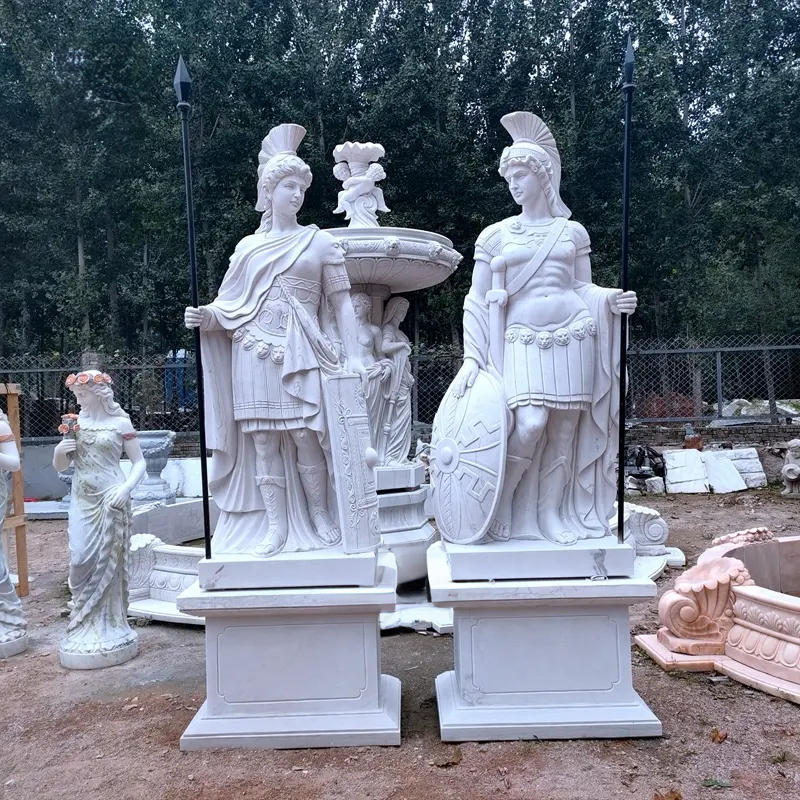 A pair of classical marble sculptures depicting Athena and Ares in full battle attire