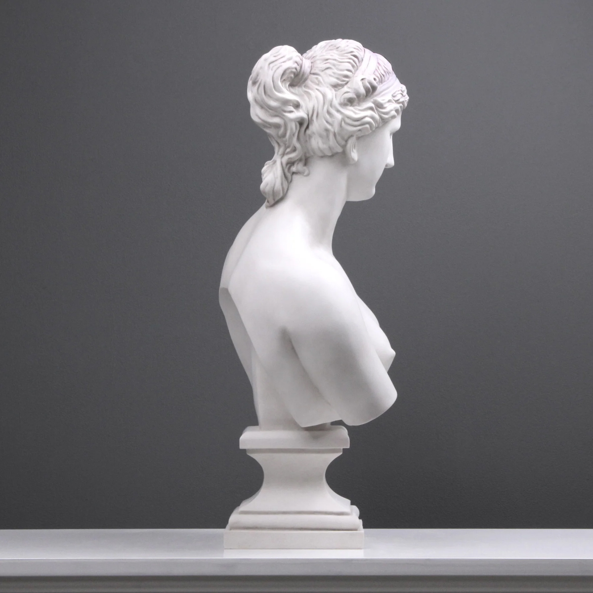 Aphrodite marble Bust Statue emphasizing soft curves and detailed hair design