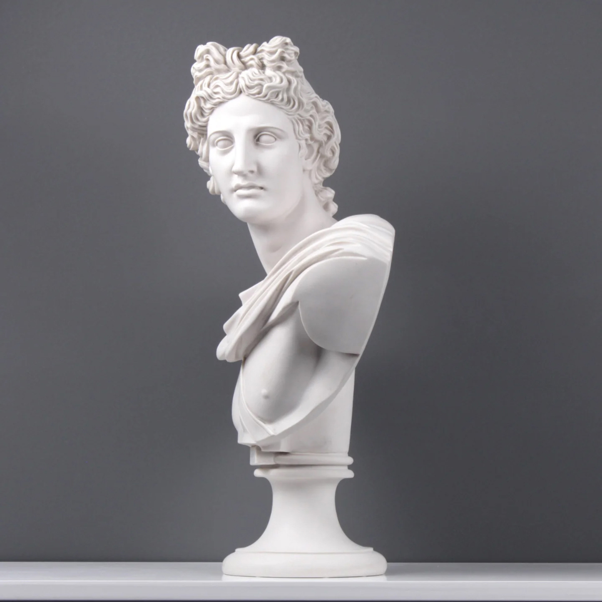 Apollo Head Bust in marble, showcasing the ribbon headband and realistic contours