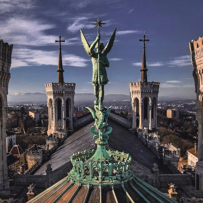 Archangel Michael statue overlooking Lyon from Fourvière Basilica