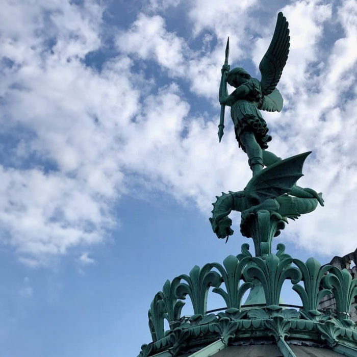 Archangel Michael statue with spear atop Fourvière Basilica, Lyon