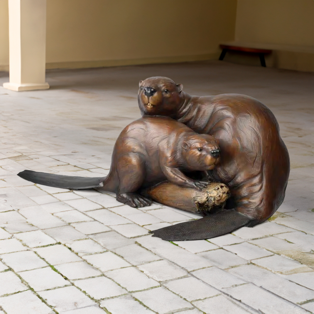 Beaver statue for sale featuring a bronze mother and baby beaver cuddled together