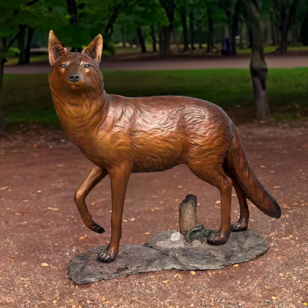 Bronze Coyote Garden Statue featuring a lifelike wild coyote pausing mid-step with raised paw